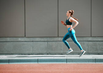 Young woman, urban running and city sidewalk with training, exercise and fitness on road. Street, runner profile and female athlete with mockup and body workout for health, wellness and race outdoor