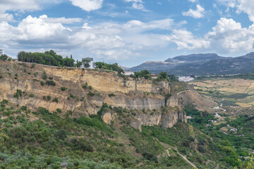 view of the cliffs of the city of ronda ,malaga, spain ,a day of stormy cloudy sky