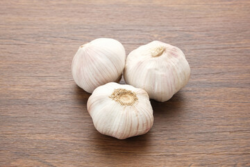 Fresh garlic (bawang putih) on a wooden table
