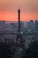 Obraz premium Panoramic aerial view of Paris, Eiffel Tower and La Defense business district. Aerial view of Paris at sunset. Panoramic view of Paris skyline with Eiffel Tower and La Defense. Paris, France.