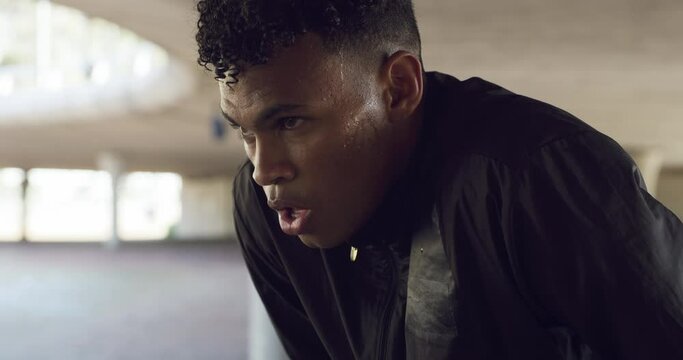 Fitness, man breathing and sweating for running, training and exercise in a parking lot. Face, sport and male athlete out of breathe from run and workout for health and wellness with a break