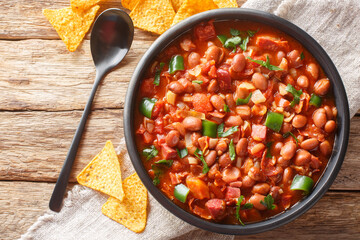 Mexican Charro Beans made with pinto beans, bacon, ham, chorizo, chili peppers, tomatoes and spices...