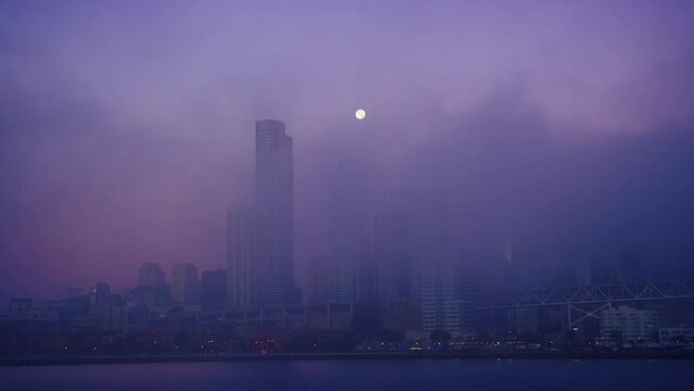 Breathtaking twilight view San Francisco downtown in thick morning fog with moon