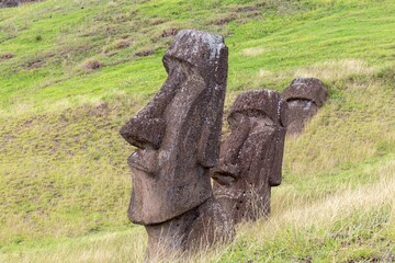 Row of Moai Sculpture Heads Side View, Rano Raraku Green Hillside, Famous UNESCO World Heritage Site. Easter Island, Rapa Nui Chile