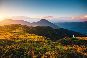 Majestic view of the mountain ranges illuminated by the sun's rays. Carpathian mountains, Ukraine.