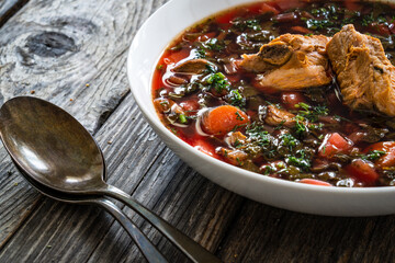 Borsch - beetroots soup on wooden table

