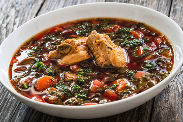Borsch - beetroots soup on wooden table
