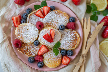 Close-up delicious pancakes, with fresh blueberries, raspberry 