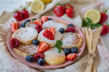 Close-up delicious pancakes, with fresh blueberries, raspberry 