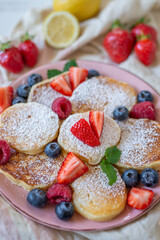 Close-up delicious pancakes, with fresh blueberries, raspberry 
