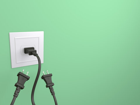 Type-A electric plug isolated on a green background. One plug has been plugged in socket