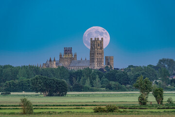 Fototapeta na wymiar Moonrise behind Ely Cathedral, 3rd June 2023