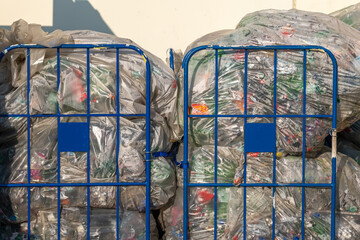 two metal trolleys with plastic waste