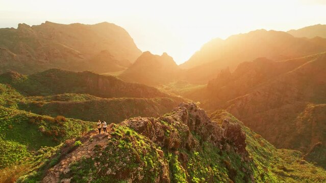 Tourists watching sunset over the volcanic landscape in Masca valley, Tenerife
