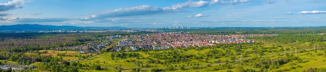 Fototapeta na wymiar Drone panorama over the outskirts of Frankfurt with the city of Moerfelden-Walldorf and the airport