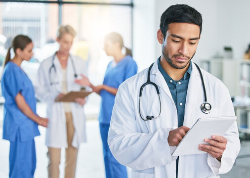 Medical, doctor and tablet with man in hospital for digital report, networking and expert research. Medicine, healthcare and app with male physician in clinic for technology, results and internet
