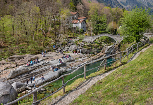 Landscape with Double-arched Ponte dei salti Roman bridge in Verzasca Valley close to Locarno, Switzerland.