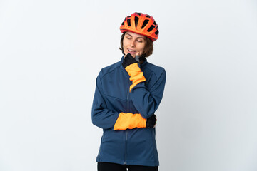 Young English cyclist woman isolated on white background looking to the side and smiling