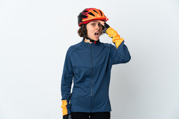 Young English cyclist woman isolated on white background doing surprise gesture while looking to the side