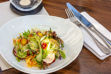 Sun dried tomatoes Salad with fresh vegetables mix and mozzarella cheese. healthy food