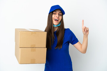 Delivery caucasian woman isolated on white background showing and lifting a finger in sign of the best