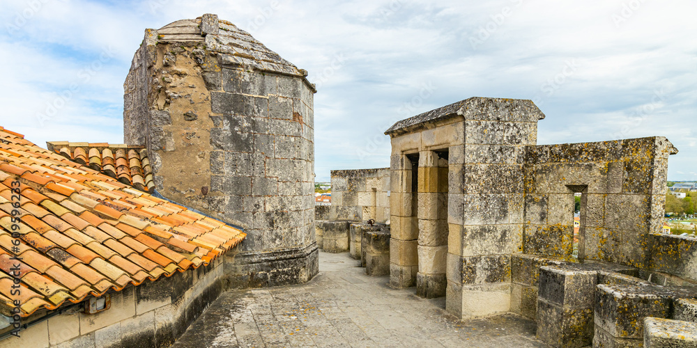 Wall mural Walkway of the Saint-Nicolas in La Rochelle, France on a summer day