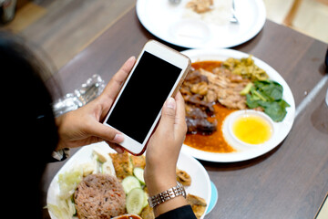 Women using mobile phones To order food online