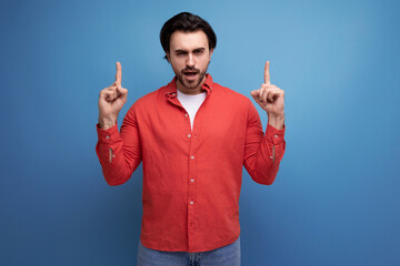 well-groomed smart 35 year old brunette millennial man with gorgeous hair communicates an idea