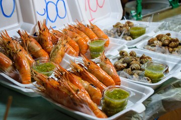 Shrimps and snails from traditional food market and bazar in Thailand