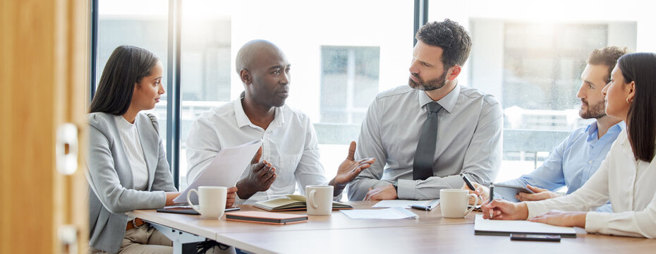 Collaboration, teamwork or business people in meeting for project management or speaking of a strategy. Black man, corporate or employees talking in discussion with our vision for growth in office