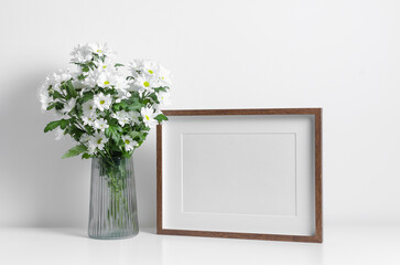 Wooden horizontal artwork frame mockup with white flowers bouquet