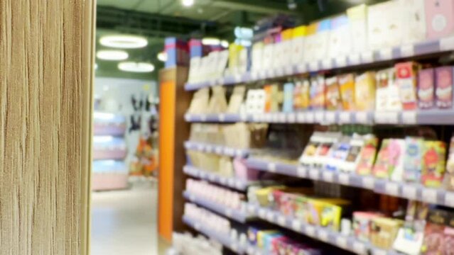 Choosing a dairy products at supermarket.Grocery stores .blurred background