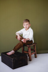 boy sitting on a chair