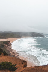 Portugal's western coastline of rocky cliffs and sandy beaches in the Odemira region. Wandering along the Fisherman trail on rainy days