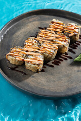 japanese cuisine sushi rolls on blue water background