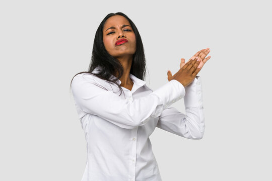 Young Indian Woman Cut Out Isolated On White Background Feeling Energetic And Comfortable, Rubbing Hands Confident.