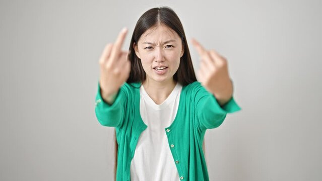 Young chinese woman doing offensive gesture with finger over isolated white background