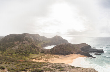 Breathtaking beach of Praia da Manteiga with its high cliffs near Vila Do Bispo, Algarve, Portugal. Wandering the Rota Vicentina. Crossing the west coast