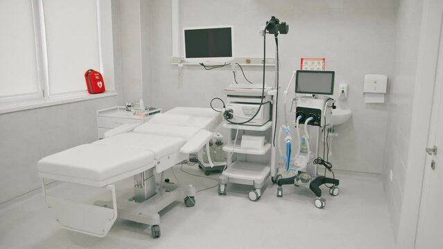 Medical equipment for gastroscopy in the office of the clinic a couch for patients and a gastroscopy with a monitor