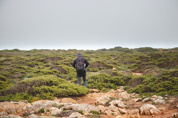 Wandering the Fisherman Trail in the southern part of Portugal during rainy weather heading to Cape St. Vicente. Rough landscape