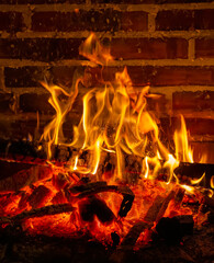 detailed close-up of wooden planks burning in a bonfire