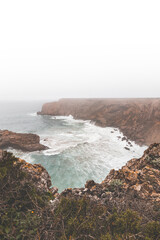 Rocky coastline of the Atlantic Ocean in the south-west of Portugal in the Algarve region. Exploring the beautiful rugged nature of the Fisherman Trail. Cape St. Vincent