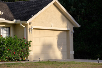 Wide garage double door and concrete driveway of new modern american house