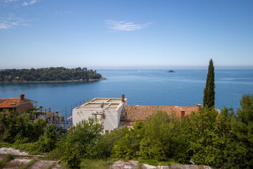 Fototapeta na wymiar panorama view of the old town of Rovinj, Croatia with red roofs and clear blue sea and a clear blue sky
