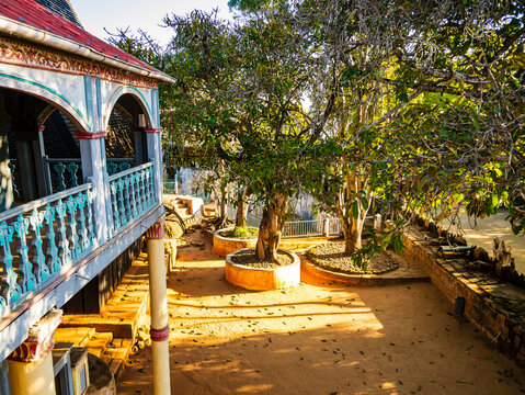 Stunning view of Fandriampahalemana palace and its beautiful courtyard with sacred fig trees, Ambohimanga, Madagascar