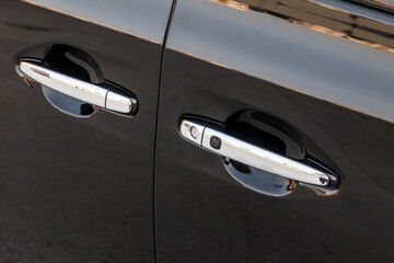 chrome car door handle with rubber keyless entry button to open the vehicle without looking for the...