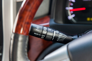 Wiper mode selection button with automatic adjustment through the rain sensor on the steering column of the car. The choice of weather.