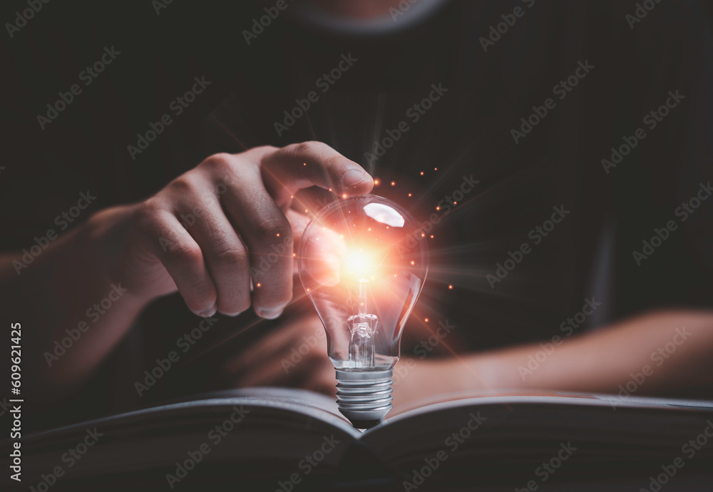 Poster man hand touching to glowing lightbulb on open book for reading to searching knowledge and creative 