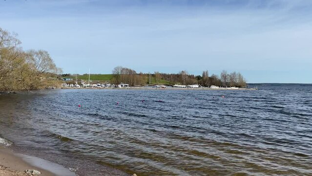 Water at M&auml;laren lake. One summer day outside in nature. Month of May. Stockholm, Sweden.