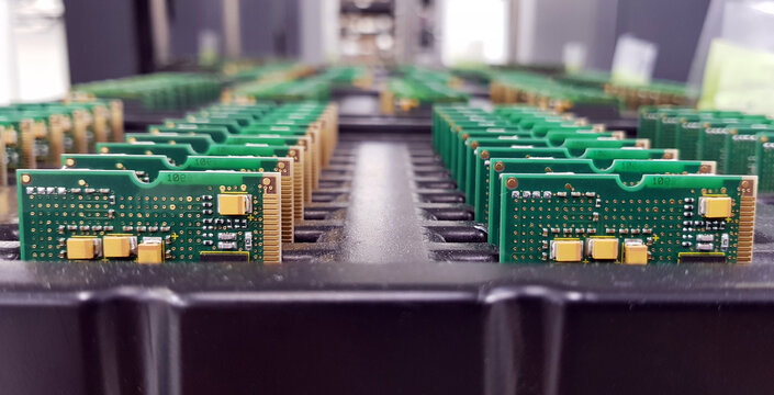Electronics Manufacturing Services, Assembly Of Circuit Board arrangement, close-up of the raw of PCBA in tray.